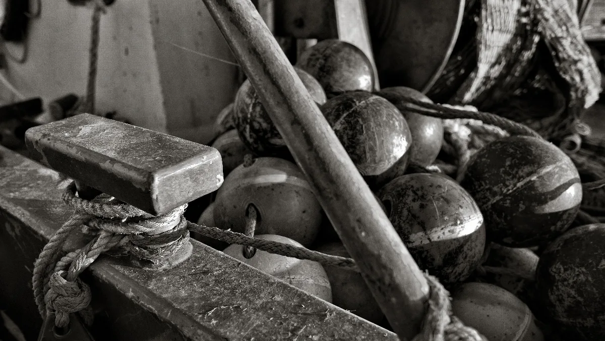 A close up detail of a fisher boat with a fishing net
