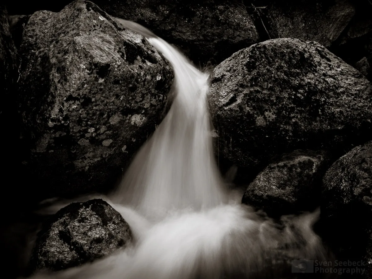 A long exposure of a small waterfall in the rocks